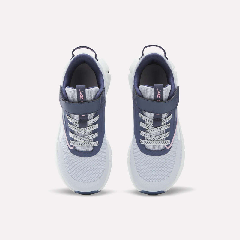 A pair of Reebok Zig Dynamica 6 Shoes for little kids, showcasing white mesh toes, blue sides, patterned laces, and Velcro straps, displayed from above on a plain white background.