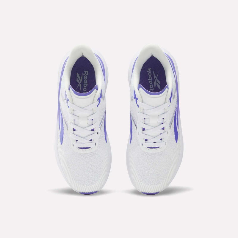 Top view of a pair of Reebok Women's Viva Speed Shoes featuring purple accents and Reebok logos on the insoles, placed side by side on a plain white background. These cushioned sneakers are crafted for comfort and style, making them perfect for active lifestyles.