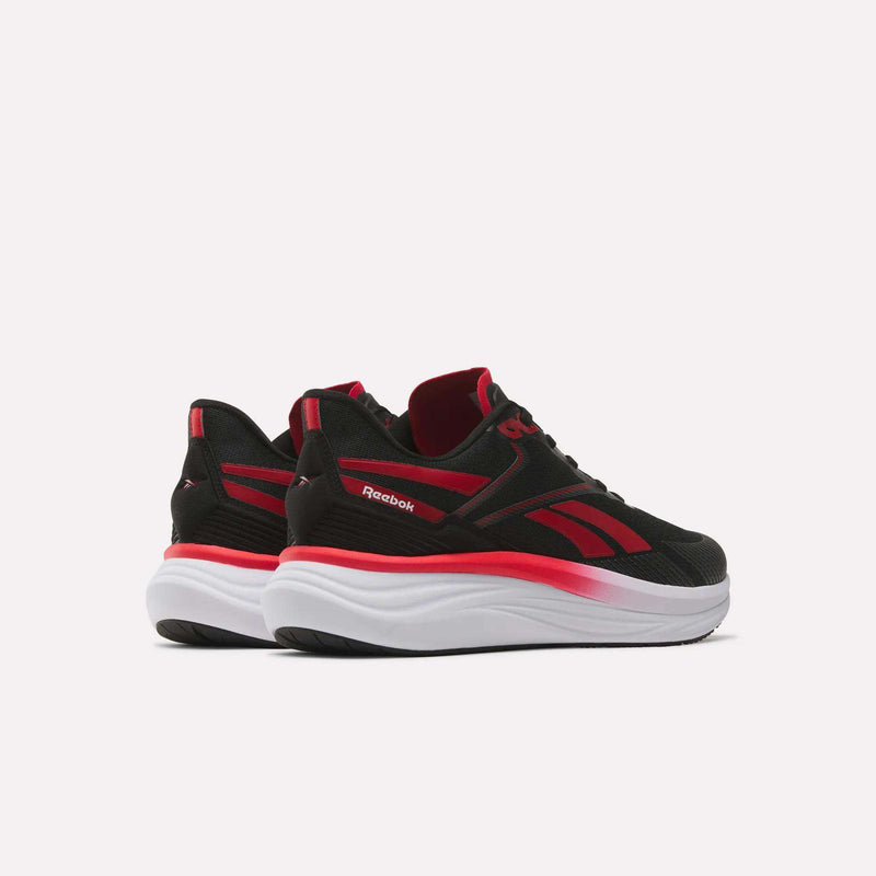A pair of Reebok Men's Viva Speed Shoes in black with red accents and thick white soles are displayed to showcase both the side and back views against a plain white background. These cushioned sneakers combine comfort with a stylish design.