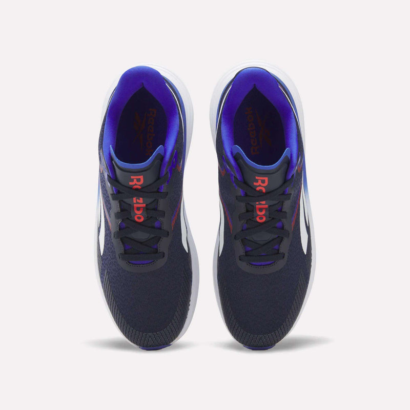 A pair of Reebok Men's Viva Speed Shoes in navy blue, featuring white soles, red Reebok logos on the tongues, and a purple inner lining, are displayed from a top view against a white background. Designed for both comfort and performance, these cushioned shoes are ideal for men seeking style and support.