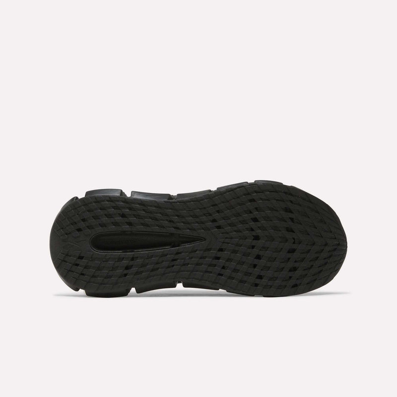 Black outsole of the Reebok Floatzig Encore Running Shoes viewed from below, showcasing a textured tread pattern for grip and a central groove for enhanced flexibility—features designed to support walking and fitness—presented against a plain white background.