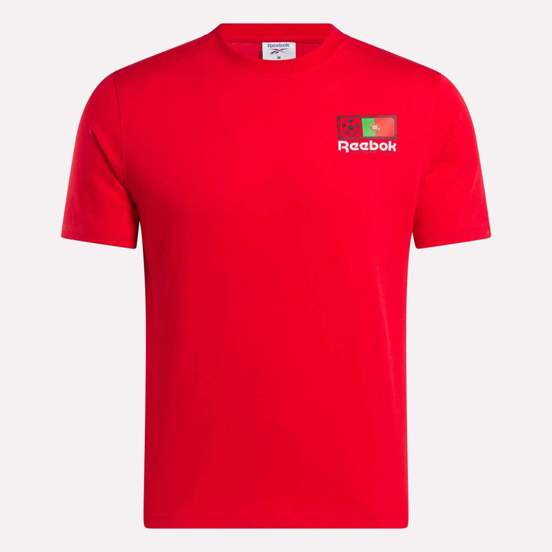 The Portugal Football T-Shirt by Reebok is a plain red short-sleeve tee with team graphics, the Reebok logo, and two small flags on the left chest. It features a crew neckline and has no other visible designs.