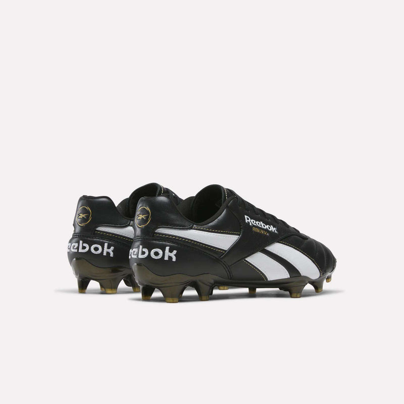 Rear three-quarter view of a pair of black Reebok RBK800 Pro Firm Ground Soccer Cleats with white side stripes and molded studs for firm ground.