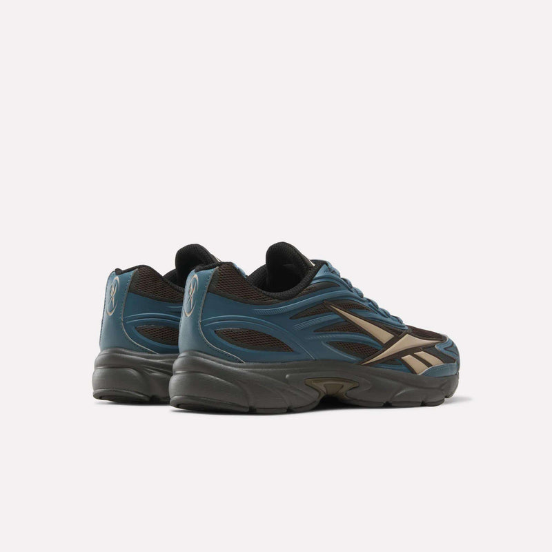 A pair of blue and brown Reebok Premier Road 1000 Shoes viewed from the rear three-quarter angle.