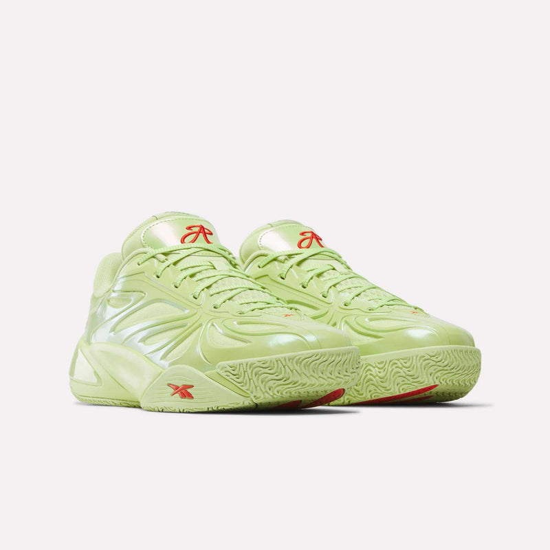 The Reebok Angel Reese 1 Basketball Shoes, in lime green with shiny textured surfaces, red logo accents, and a chunky sole featuring the Energy Return System, are displayed against a plain white background.
