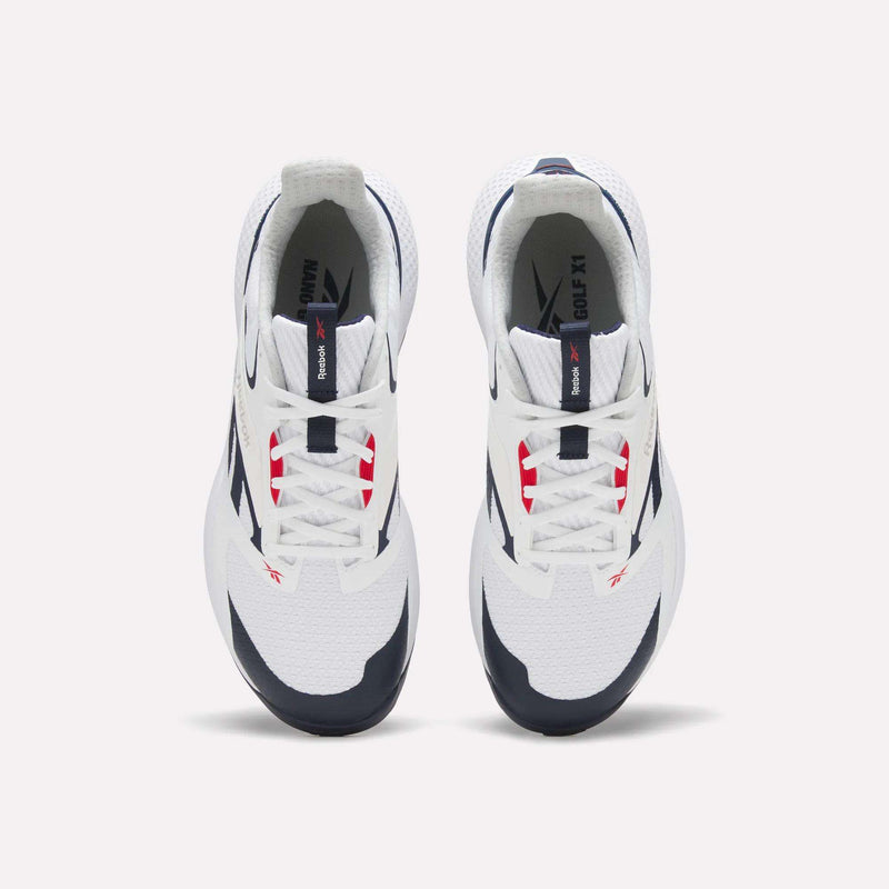Top view of a pair of white Reebok Nano Golf Shoes with navy and red accents, white laces, black outsoles, and lightweight FlexWeave for comfort, positioned side by side on a plain light background.