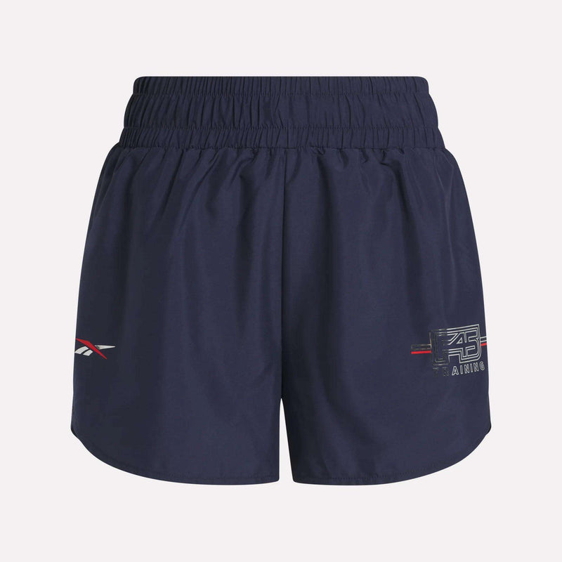 Women's Reebok x F45 Training Coach Lux Shorts in navy blue with elastic waistband, small logos and text on both legs, relaxed fit, by Reebok. No visible pockets.
