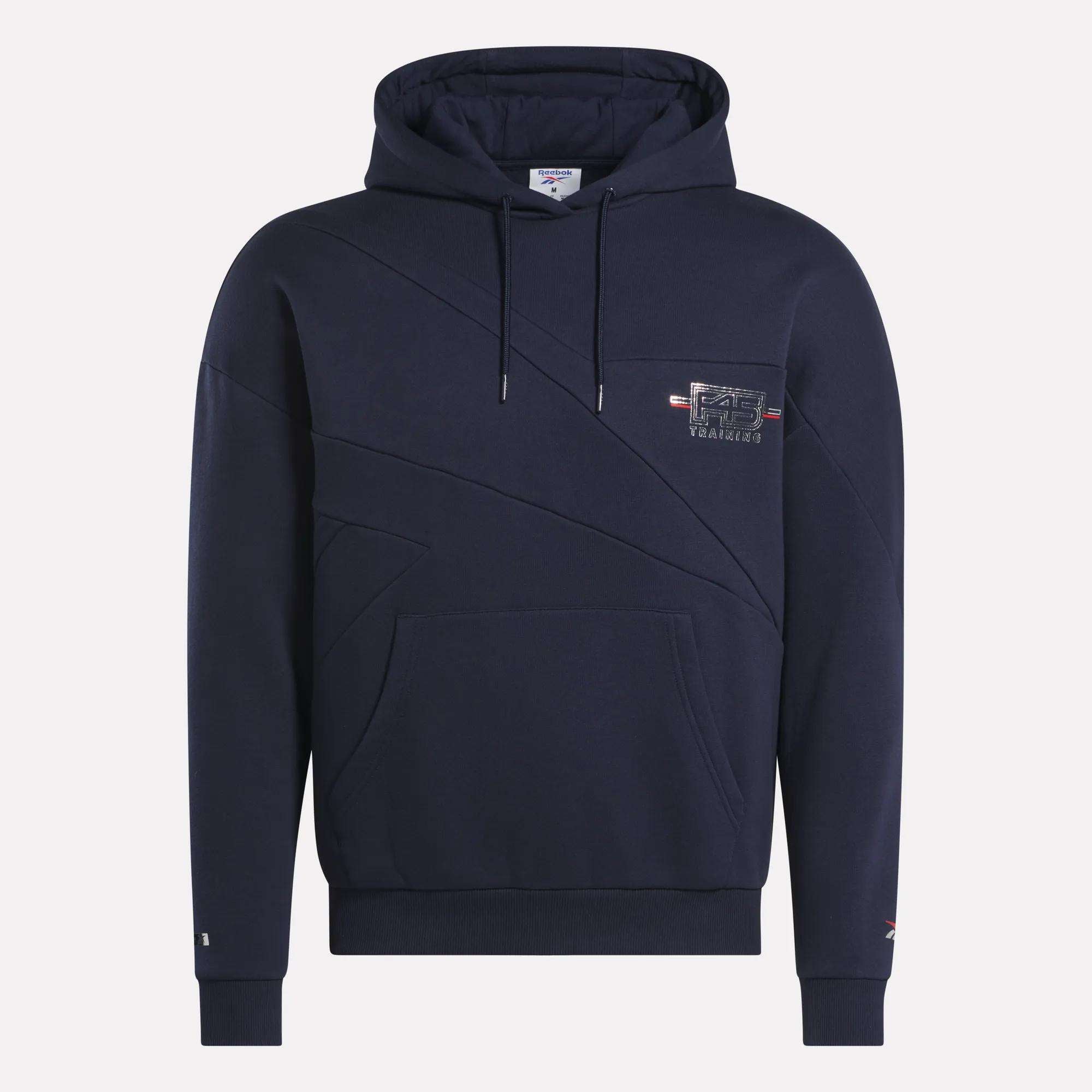 The Men's Reebok x F45 Training Coach Fleece Hoodie in navy features a small left-chest logo patch, kangaroo pocket, ribbed cuffs and hem, black drawstrings, and diagonal seams for added style.