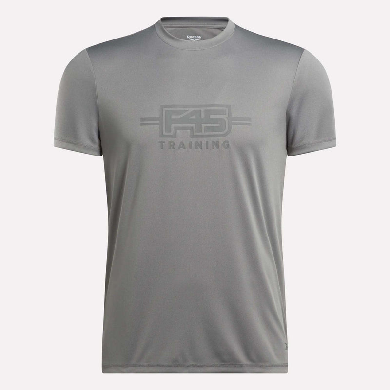 The Men’s Reebok x F45 Training T-Shirt by Reebok is a gray, short-sleeve men’s tee featuring “F45 Training” printed on the front in coordinating gray lettering, made with signature Reebok performance quality, and shown against a plain white background.