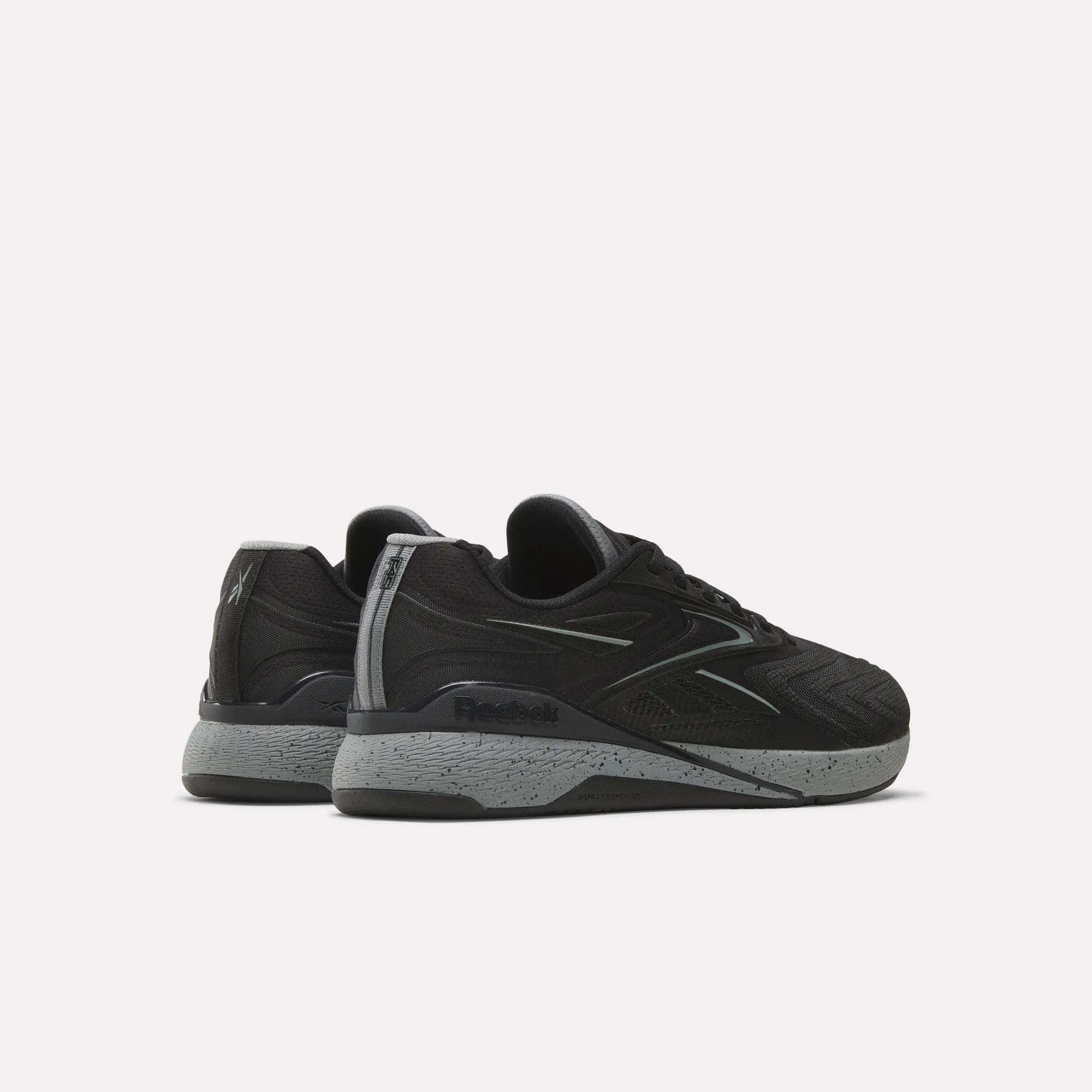 A pair of black Reebok x F45 Nano X5 Edge training shoes with gray soles, shown from the back and side on a plain white background.