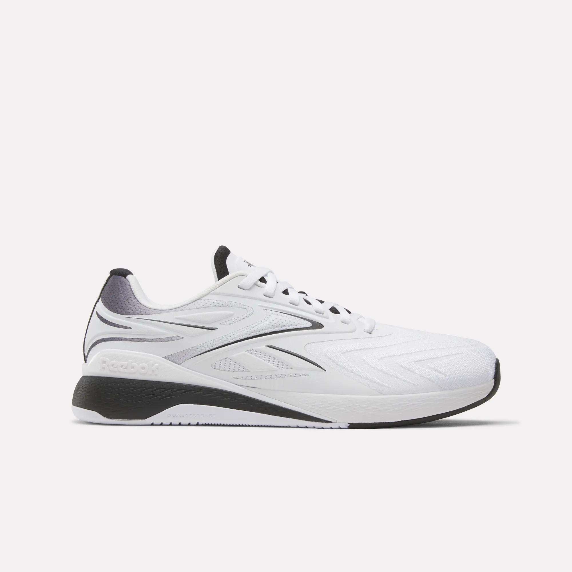 White Reebok x F45 Nano X5 Edge training shoes with black and gray accents, low top design, lace-up closure, and textured rubber sole are displayed on a plain light background.