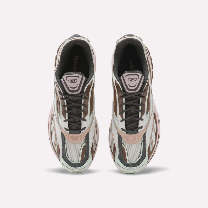 A pair of Reebok Premier Road Ultra SV Shoes viewed from above, featuring stylish white, brown, and light pink accents with black laces, mesh panels, and the iconic Reebok logo visible on the tongue—modern running shoes that pay homage to classic Y2K style.
