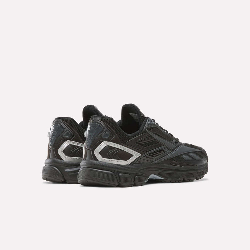 A pair of Reebok Premier Road Ultra SV Shoes in black with silver accents, displayed on a white background. The sneakers are angled to showcase both the sides and backs, featuring a design inspired by iconic Y2K running shoes.