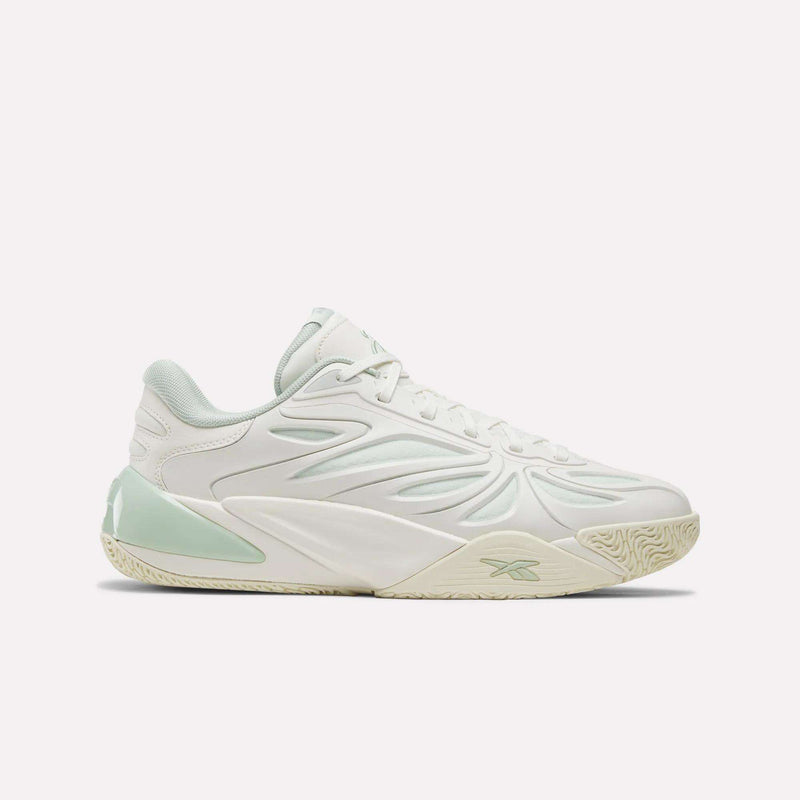 Introducing the Angel Reese 1 Basketball Shoes by Reebok—a performance sneaker in Chalk/Vintage Chalk/Dew with eye-catching light mint accents, an intricate side pattern, lace-up closure, and a textured sole. Featuring the innovative Reebok Energy Return System, these stylish shoes are displayed in a sleek side profile against a plain white background.