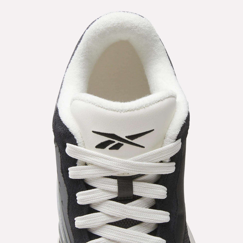 Top view of the Reebok Omni Edge Shoes in black and white, featuring white laces and the Reebok logo on the tongue, crafted from premium materials for a hoops-inspired look that’s perfect for the basketball court.