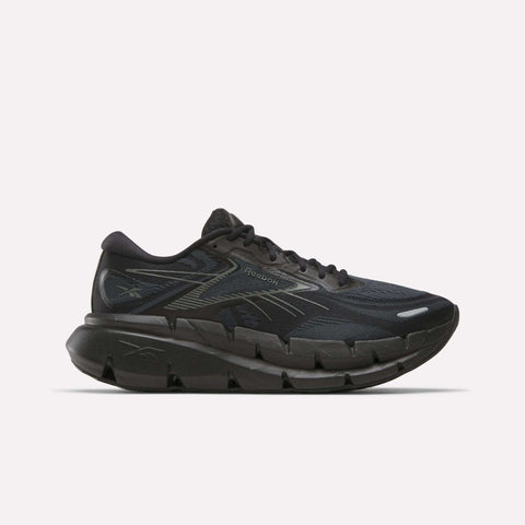 Men's FloatZig Double Running Shoes by Reebok in Black/Black/Grey, featuring a mesh upper, signature side stripes, and a thick segmented cushioned sole for maximum comfort—shown on a plain white background.