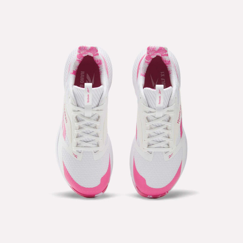 Top view of Reebok Nano Golf Shoes, featuring a white FlexWeave upper with pink branding accents. These lightweight performance golf shoes are shown side by side on a plain white background.