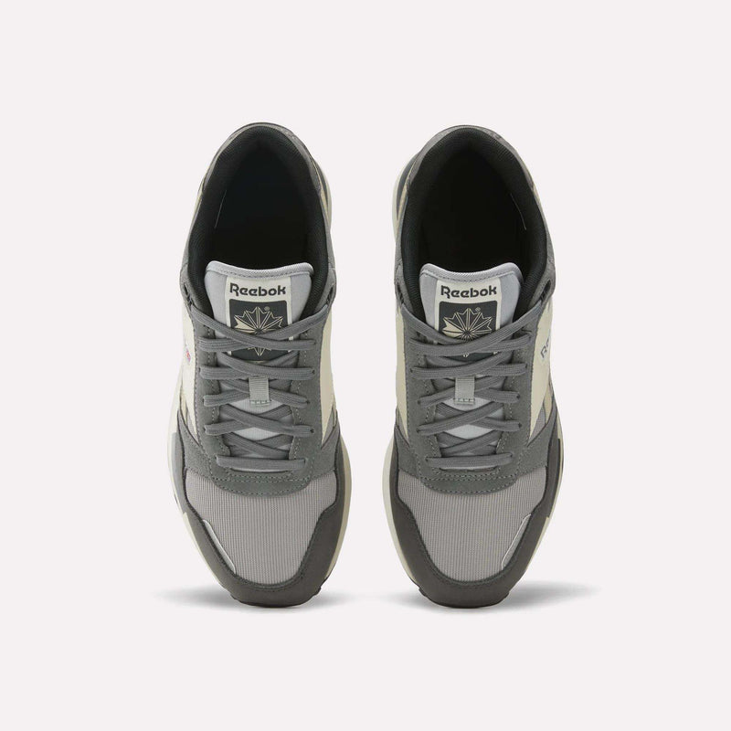 A top-down view of the Men's GL1600 Shoes by Reebok, featuring a gray suede upper with white accents and laces, displays the archive-inspired design with both shoes neatly positioned side by side on a plain white background.