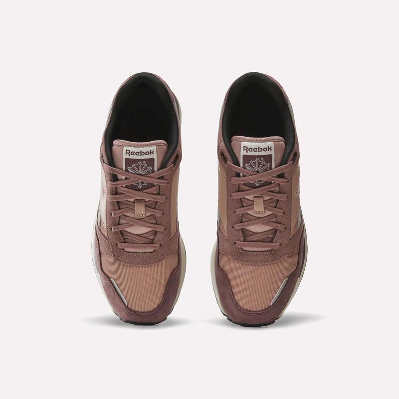 A pair of Men’s GL1600 Shoes by Reebok in mauve suede, seen from above with the laces tied and the Reebok logo visible on each tongue.