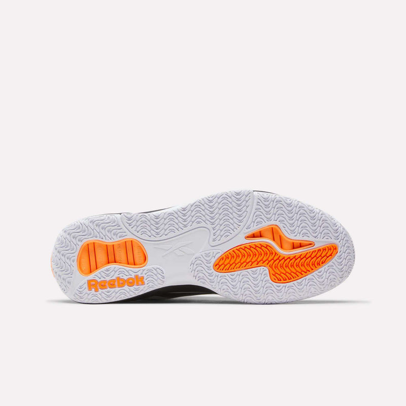 Reebok Engine A Pump shoe outsole in white with a herringbone tread pattern and orange accent sections.