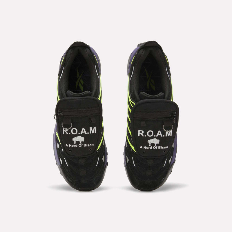 Reebok x A Herd of Bison Men’s Trailzillo DMX Shoes in black with lime green accents, featuring a zip-pocket lace cover, R.O.A.M. branding, DMX Dynamic Air Cushioning, and a Vibram rubber outsole.