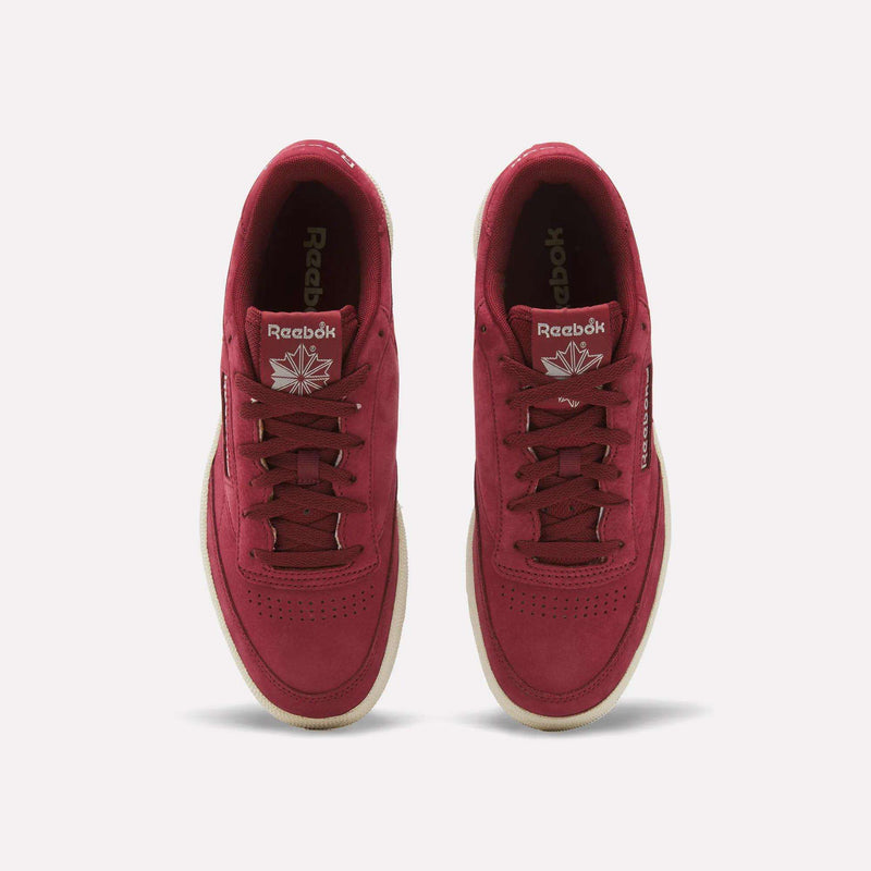 A pair of Men’s Club C 85 Shoes by Reebok in red, displayed from above to show the laces, perforated toe boxes, and side Reebok logos, set against a plain white background.
