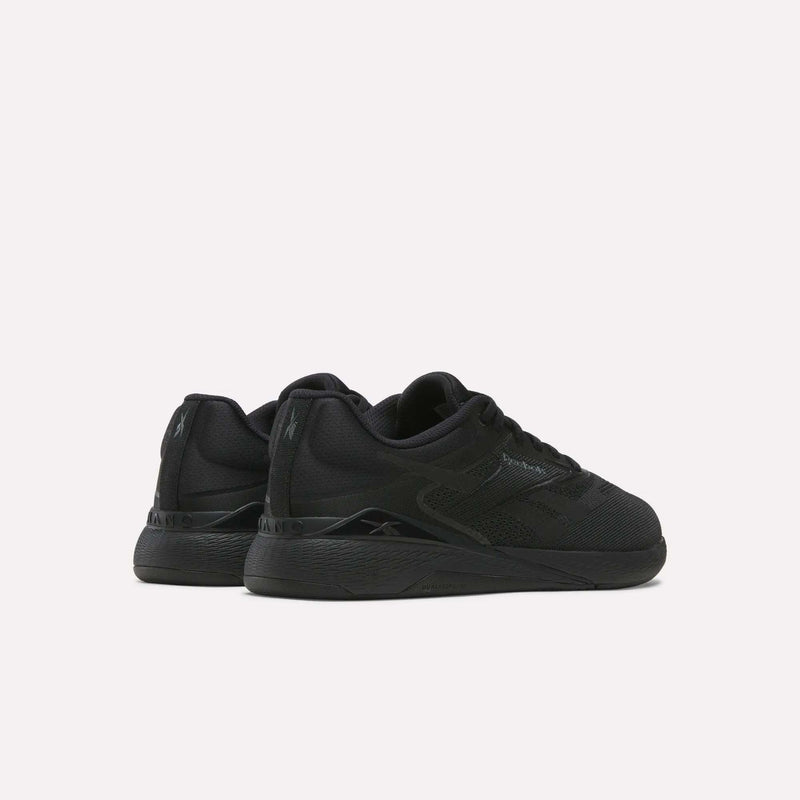 A pair of black Reebok Nano X5 Training Shoes with textured soles and subtle branding, shown side by side on a plain white background from a rear-side angle—ideal training shoes for comfort.