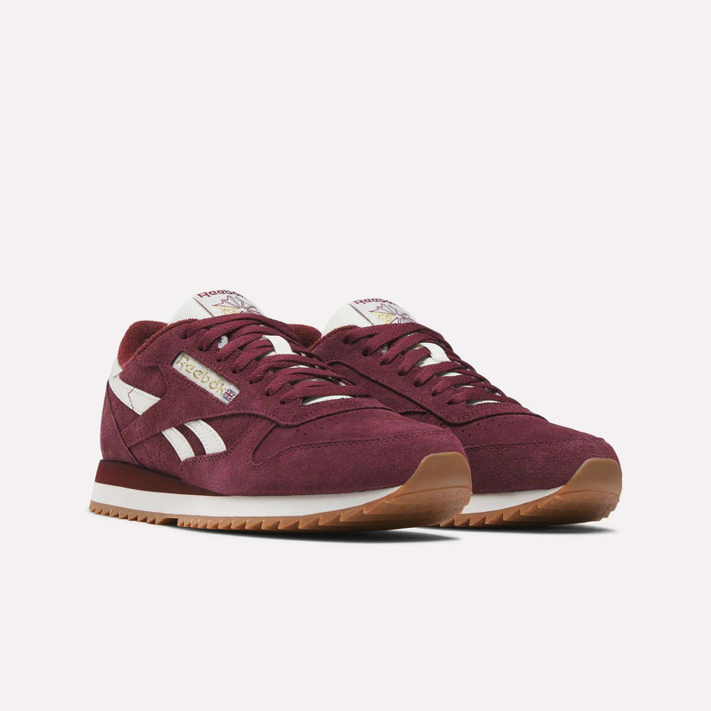 A pair of Reebok Men’s Classic Leather Ripple Shoes in maroon, featuring white stripes, gum soles, and an EVA midsole, displayed on a plain white background.