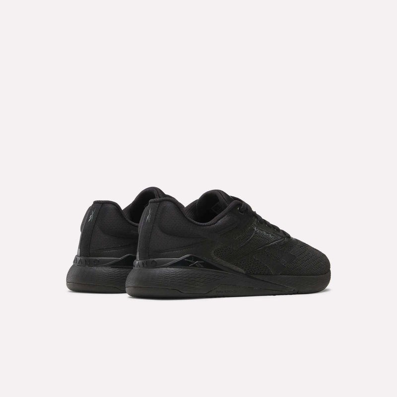A pair of black Reebok Women’s Nano X5 Training Shoes, shown from the back and side on a plain white background—ideal training footwear that combines comfort and performance.