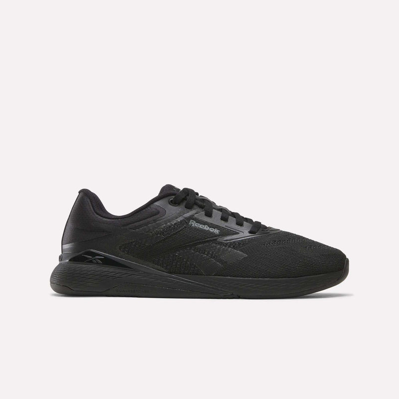 An espresso-colored athletic sneaker with a mesh upper, matching sole, and subtle Reebok branding on the side, the Women’s Nano X5 Training Shoes by Reebok are displayed on a plain white background—ideal training shoes designed for all-day comfort.