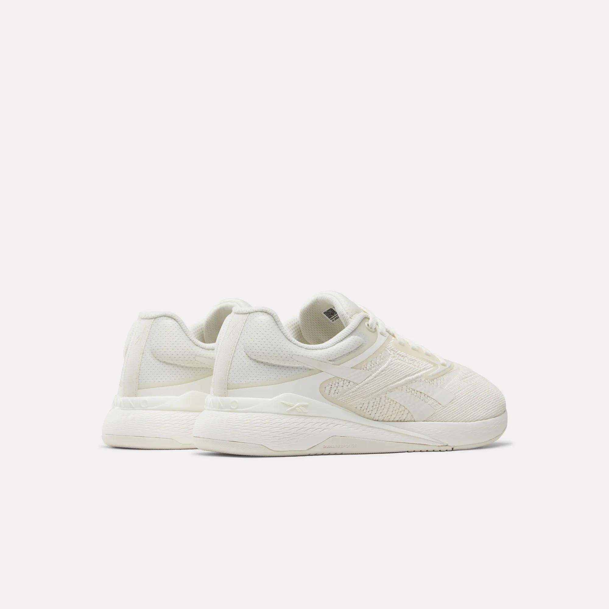 A pair of Reebok Nano X5 Women's Training Shoes in off-white, featuring textured uppers and thick soles, displayed at an angle against a plain white background.