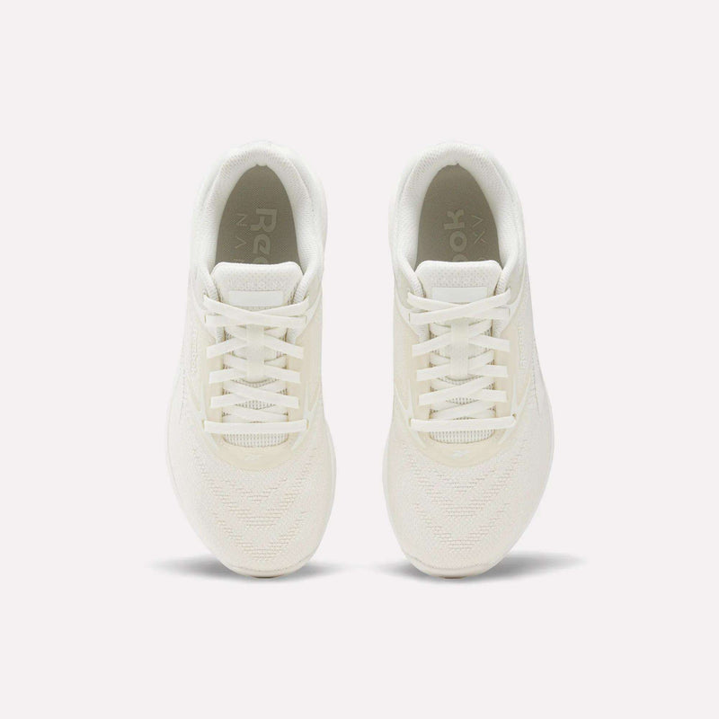 The Reebok Nano X5 Women's Training Shoes, shown from above on a plain white background, highlight their white color, laces, mesh texture, and soles.