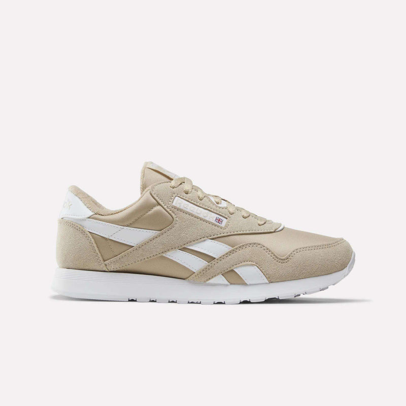 Elevated Beige and white Men’s Classic Nylon Shoes by Reebok, featuring a white sole, classic white side stripes, and a small Union Jack logo near the laces—timeless men’s sneakers inspired by retro styles, shown on a plain white background.