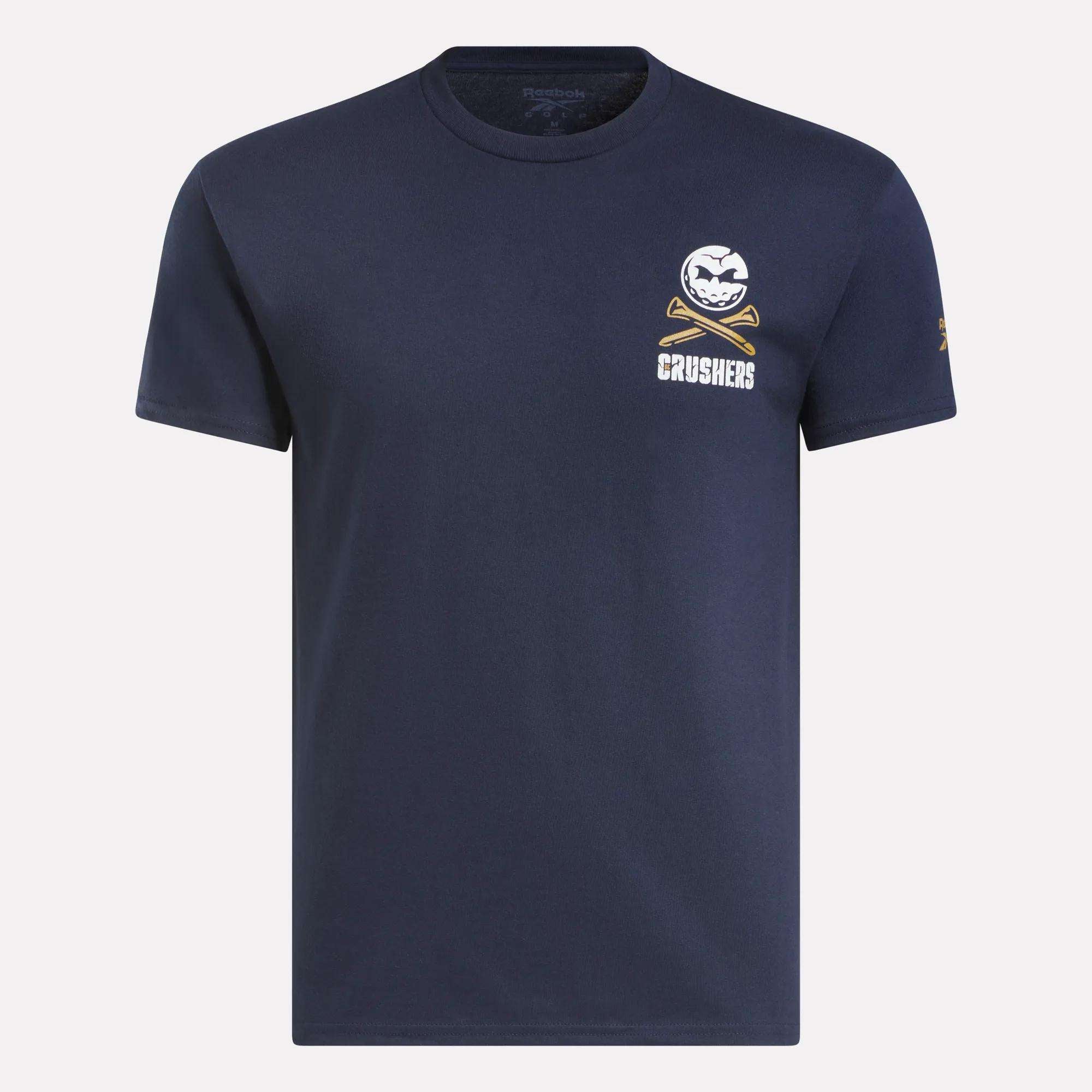 The Men's Crushers Stacked Logo Tee by Reebok is a navy short-sleeve shirt featuring a small white baseball and crossed bats graphic above “CRUSHERS” on the left chest, inspired by Bryson DeChambeau’s team spirit.