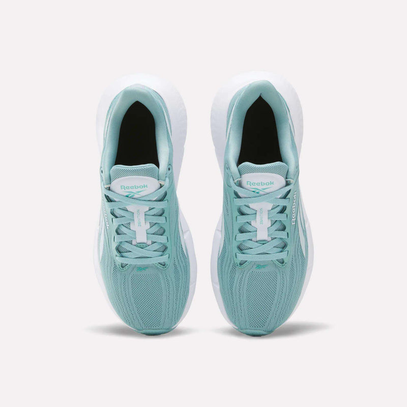 A pair of Reebok Women’s Zignition Running Shoes in teal, viewed from above, display their mesh uppers, white soles, and white laces, positioned side by side on a plain light background.
