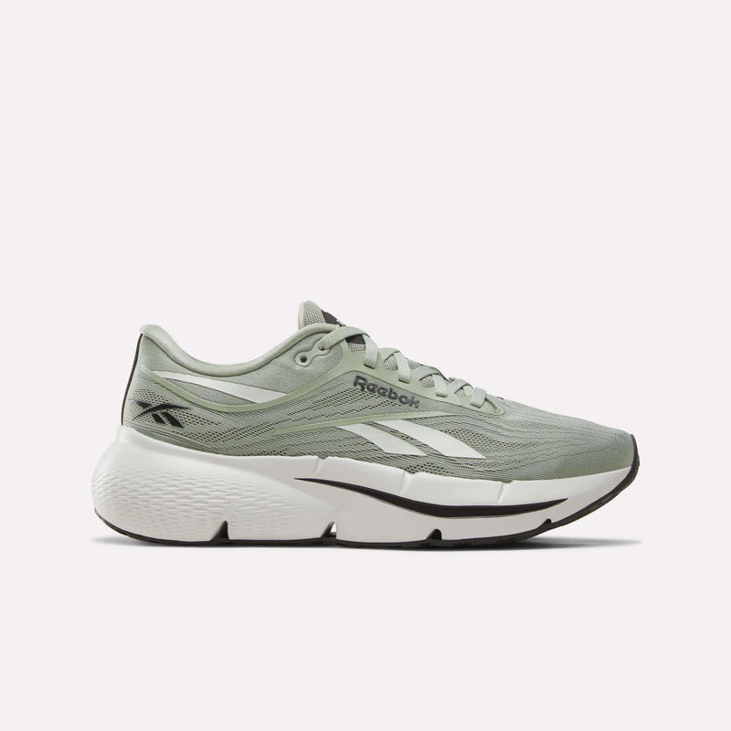 Introducing the Reebok Men’s Zignition Running Shoes in green, grey, and black. These men’s running shoes feature a breathable mesh upper, a wide forefoot for extra comfort, a thick and springy cushioning sole for enhanced performance, a white midsole, black outsole, and the iconic white Reebok logo.