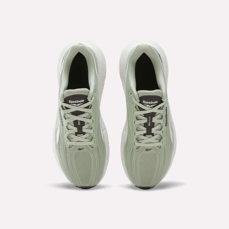 A pair of light green Reebok Men’s Zignition Running Shoes viewed from above on a white background, displaying the laces, mesh texture, and Reebok logo on the tongue of each shoe. Featuring springy cushioning and a wide forefoot for enhanced comfort and support.