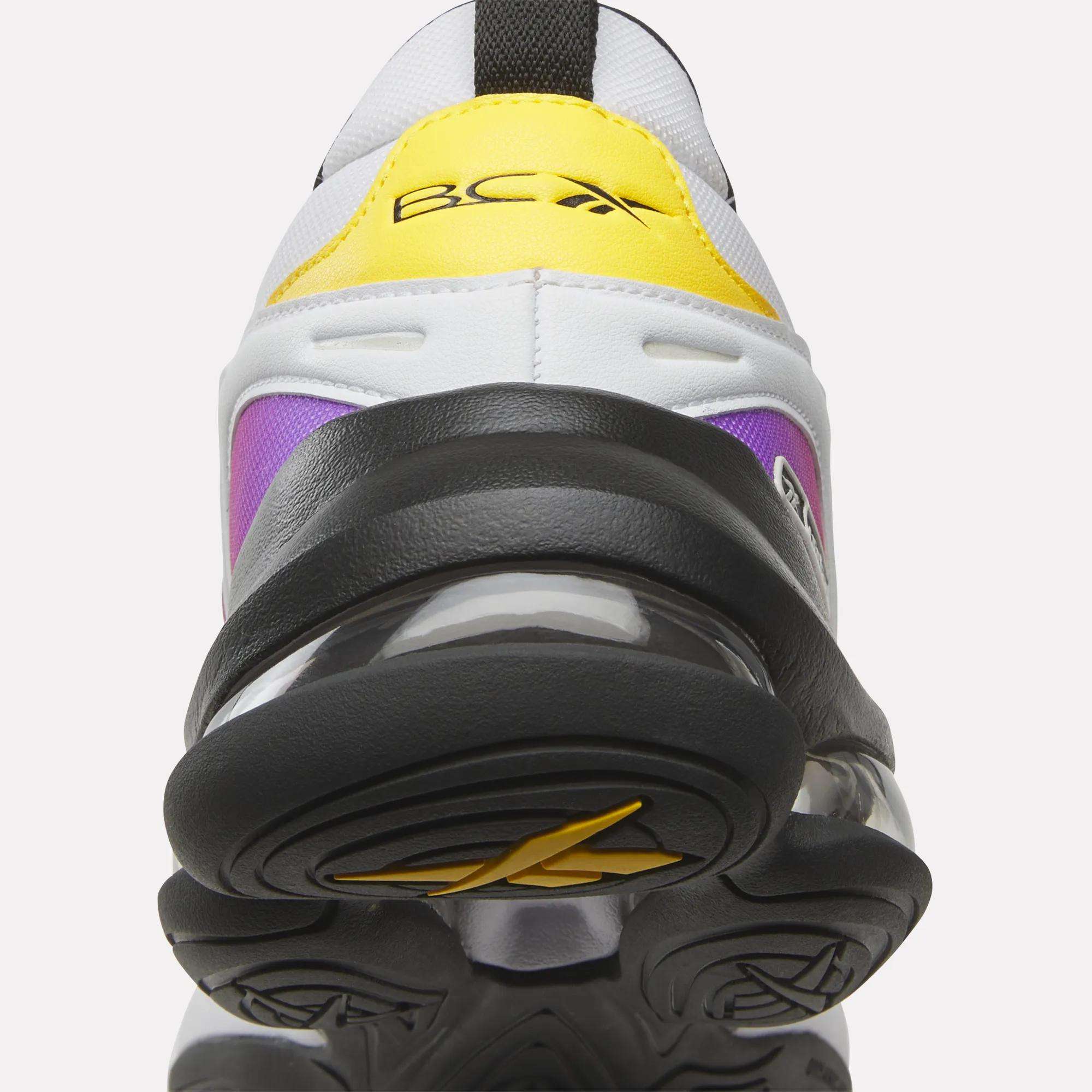 Close-up of a colorful sneaker with a prominent sole on a white background