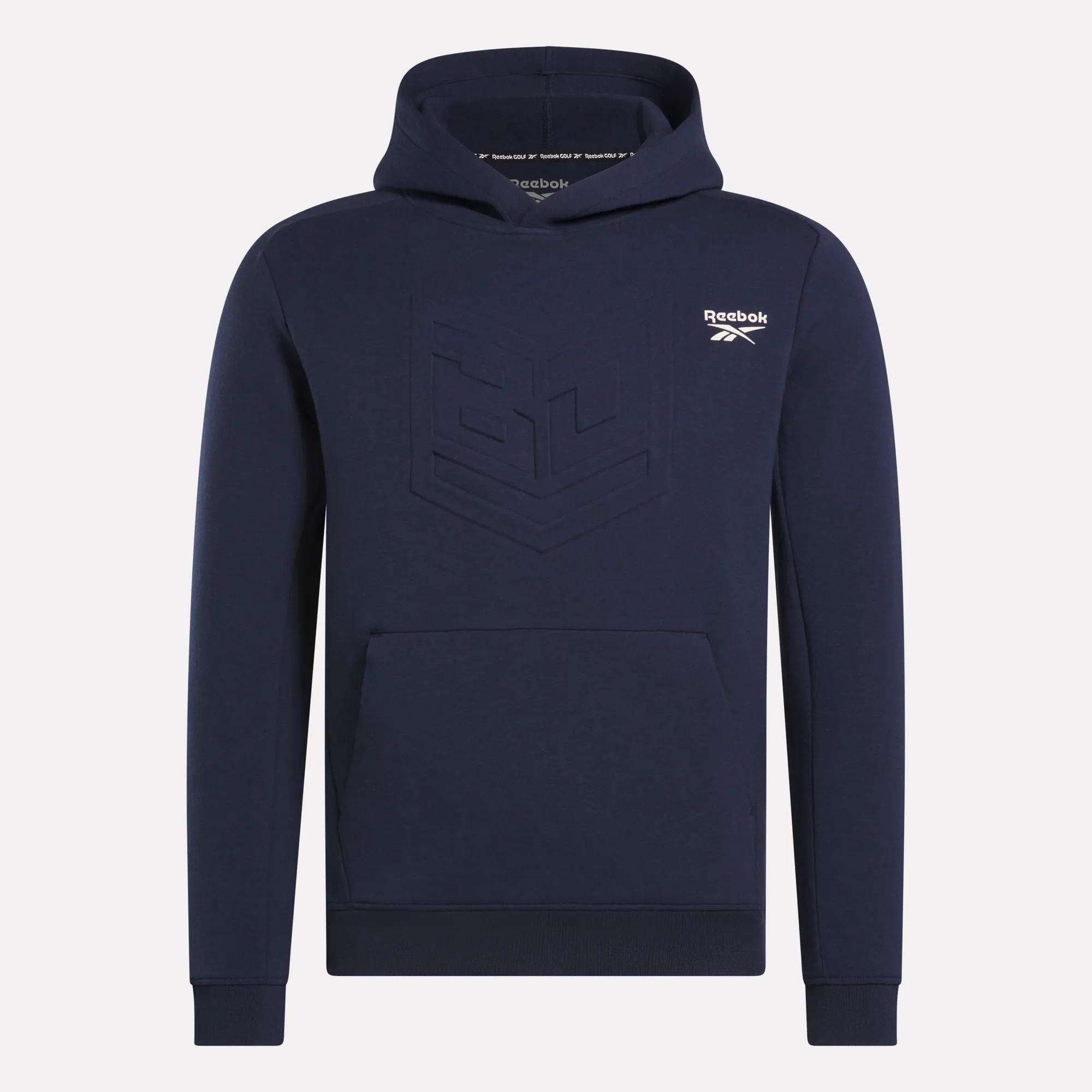 The Reebok Men's Scuba Knit Hoodie Sweatshirt is navy blue with a front pouch pocket, an embossed geometric chest design, moisture-wicking fabric, and a white Reebok logo on the left chest.
