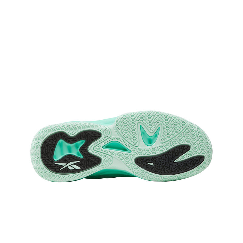 The image shows the mint green outsole of the Reebok Angel Reese 1 Basketball Shoes for Big Kids, featuring black and white accents and a wavy textured tread pattern for enhanced grip.