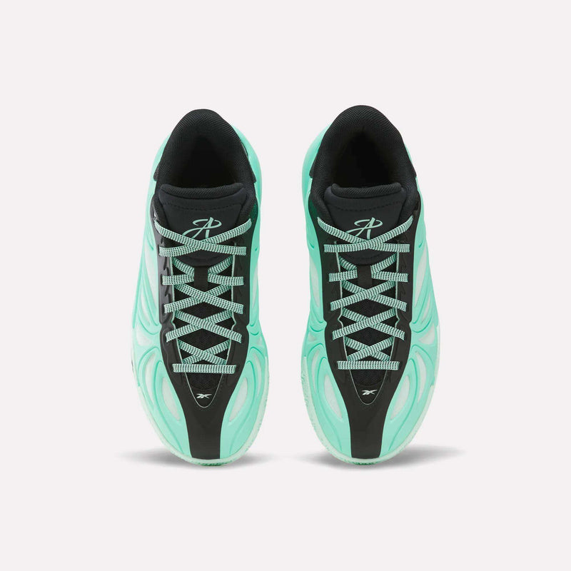 A pair of mint green and black Angel Reese 1 Basketball Shoes from Reebok, seen from above with white laces and a stylized logo on each tongue—these Reebok sneakers for big kids blend style and comfort, making them ideal for young athletes.