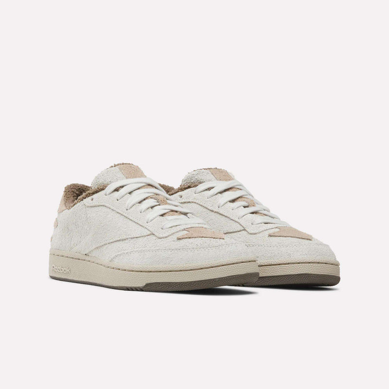 Off-white Reebok x Avatar Club C 85 Shoes featuring textured hairy suede uppers, a brown fleece-like lining, and gum rubber soles.