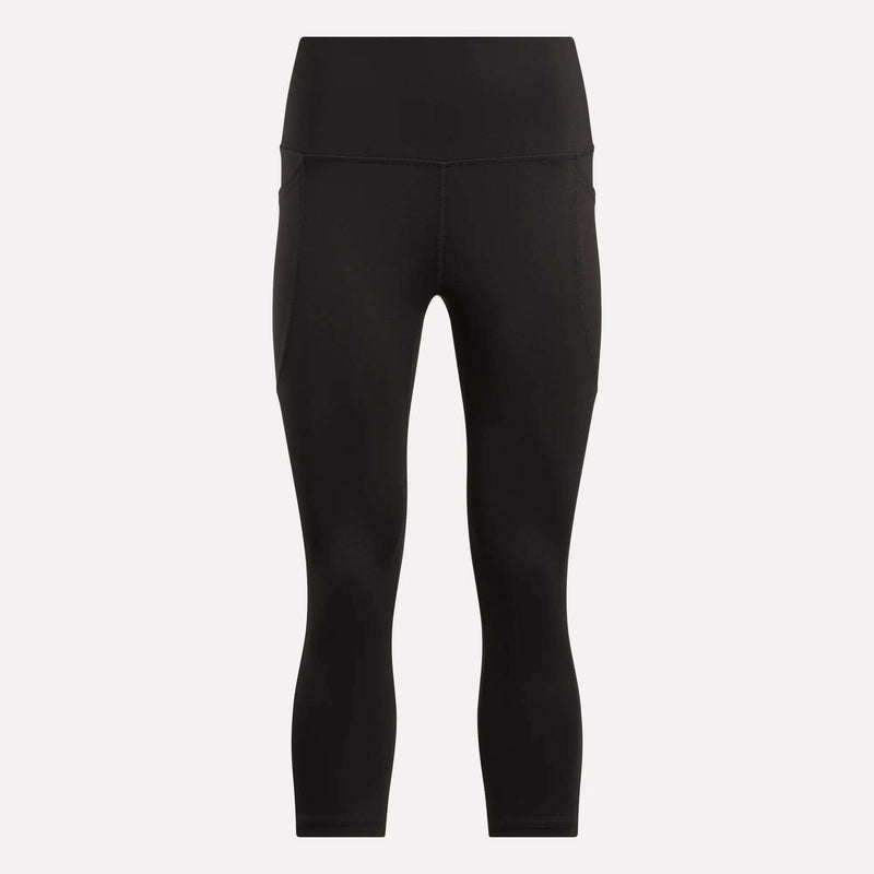 Women's Capri Leggings by Reebok in black, featuring a high waist, ankle length, side pockets, and an adjustable waistband. Shown on a plain white background.