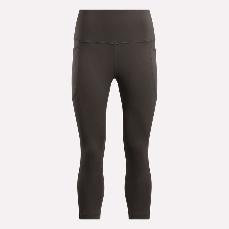 Reebok Women's Capri Leggings in black, shown on a plain light background. These fitted, high-waisted leggings offer a smooth finish, subtle seam details, and ankle-length style—ideal for any fitness routine.