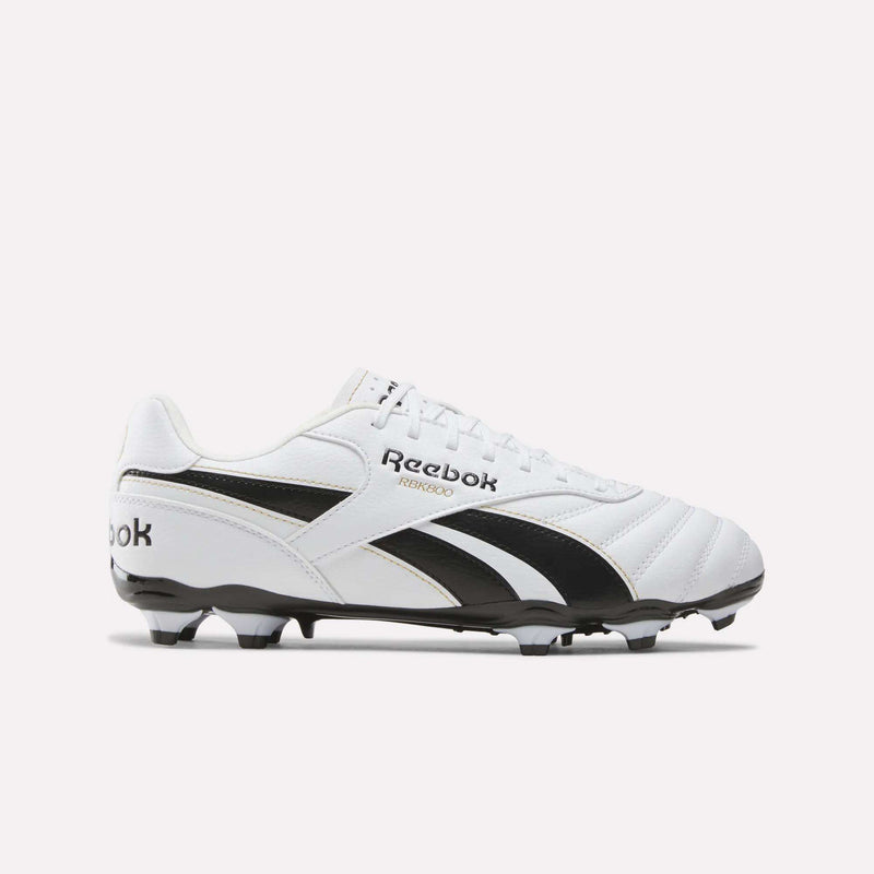 The Reebok RBK800 League Firm Ground Soccer Cleats in White/White/Black feature black accents, a studded black sole for firm ground play, and a black Reebok logo on the side, displayed against a plain white background.