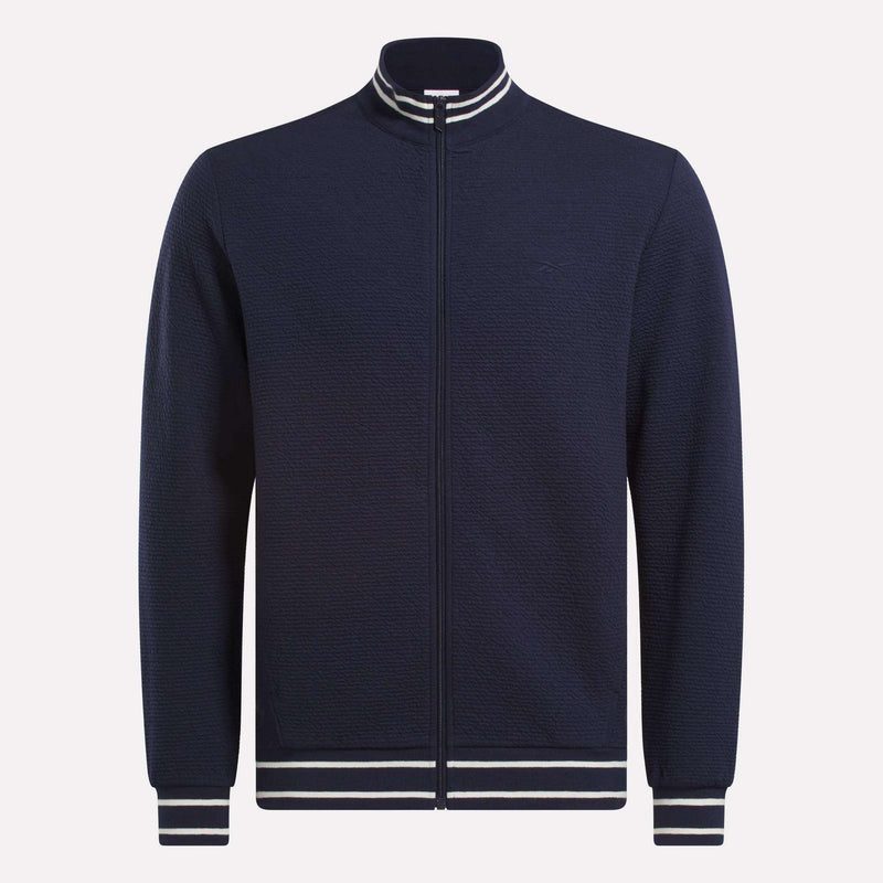 The Reebok Men's Club Sport Textured Jacket is a navy zip-up with thermal knit fabric and white/navy striped ribbed collar, cuffs, and hem, shown on a plain white background.