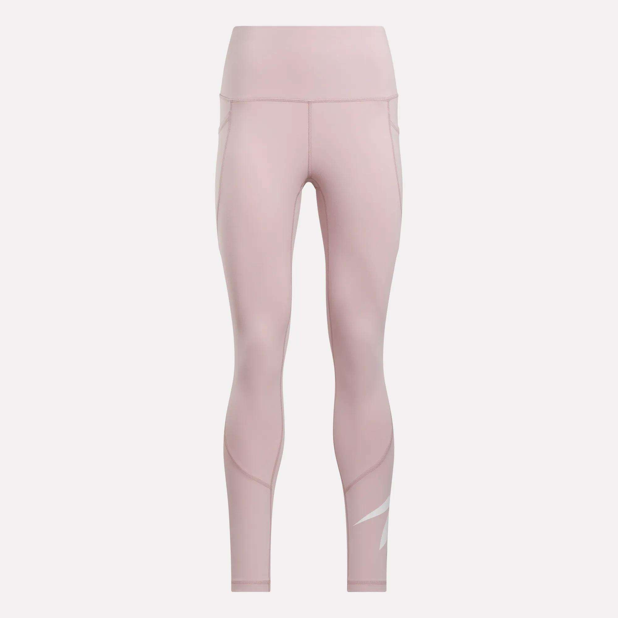 Reebok Women's High-Rise Tights 26" in light pink, featuring subtle seam details and a white logo on the lower left leg, displayed on a plain white background.