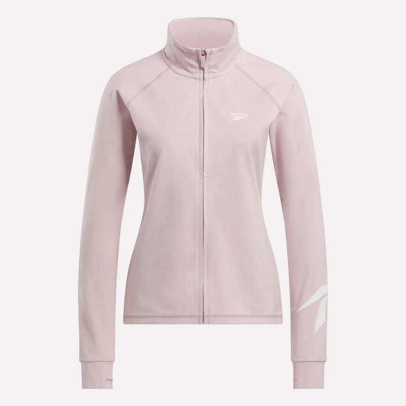 The Reebok Women's Motion Core Full-Zip Hoodie in light pink features long sleeves, a high collar, and white Reebok logos on the chest and lower sleeve—perfect for workouts, shown on a plain white background.
