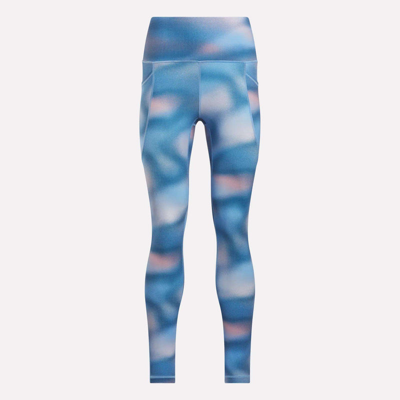 The Reebok Women’s Fluid Print High-Rise Tights feature a blue and pink abstract pattern, side pockets, moisture-wicking fabric, and a smooth, fitted silhouette—all shown against a plain white background.