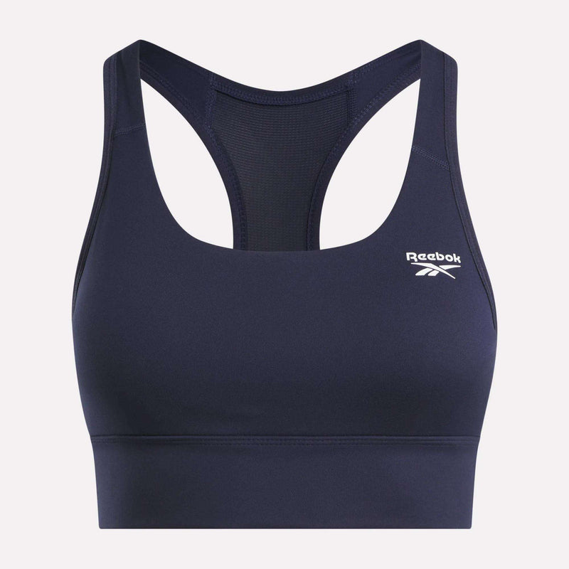 The Reebok Women's Rush Medium-Impact Sports Bra features a navy blue racerback design, mesh back panel, and a white logo on the left chest—perfect for medium-impact workouts.